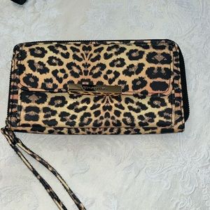 Tahari zip around animal print wristlet.